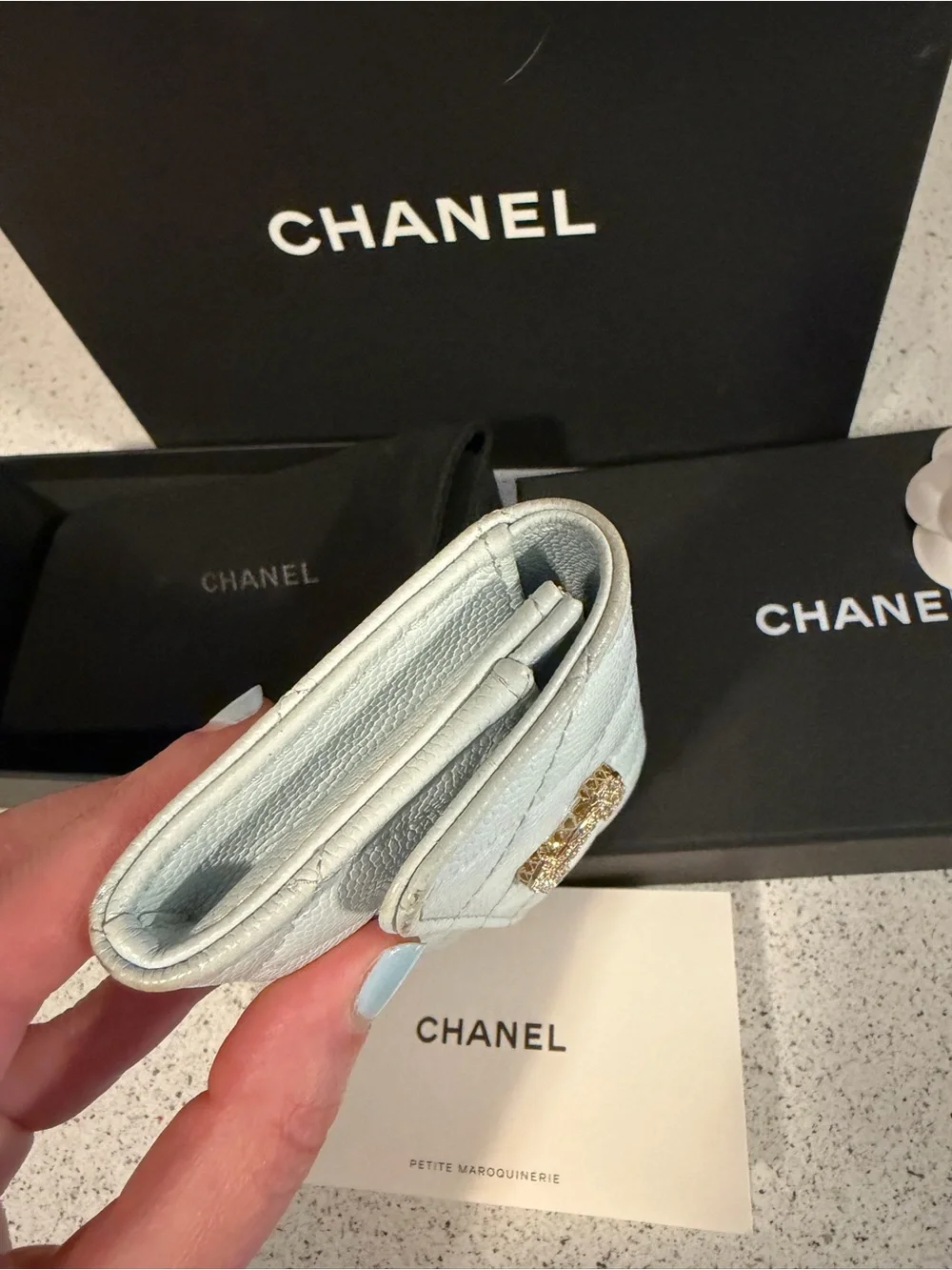 Chanel shiny caviar quilted crystal CC flap card holder light blue